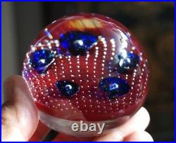 A Beautiful Murano Glass Paperweight With Ruby Red And Purple Flowers On Bubbles